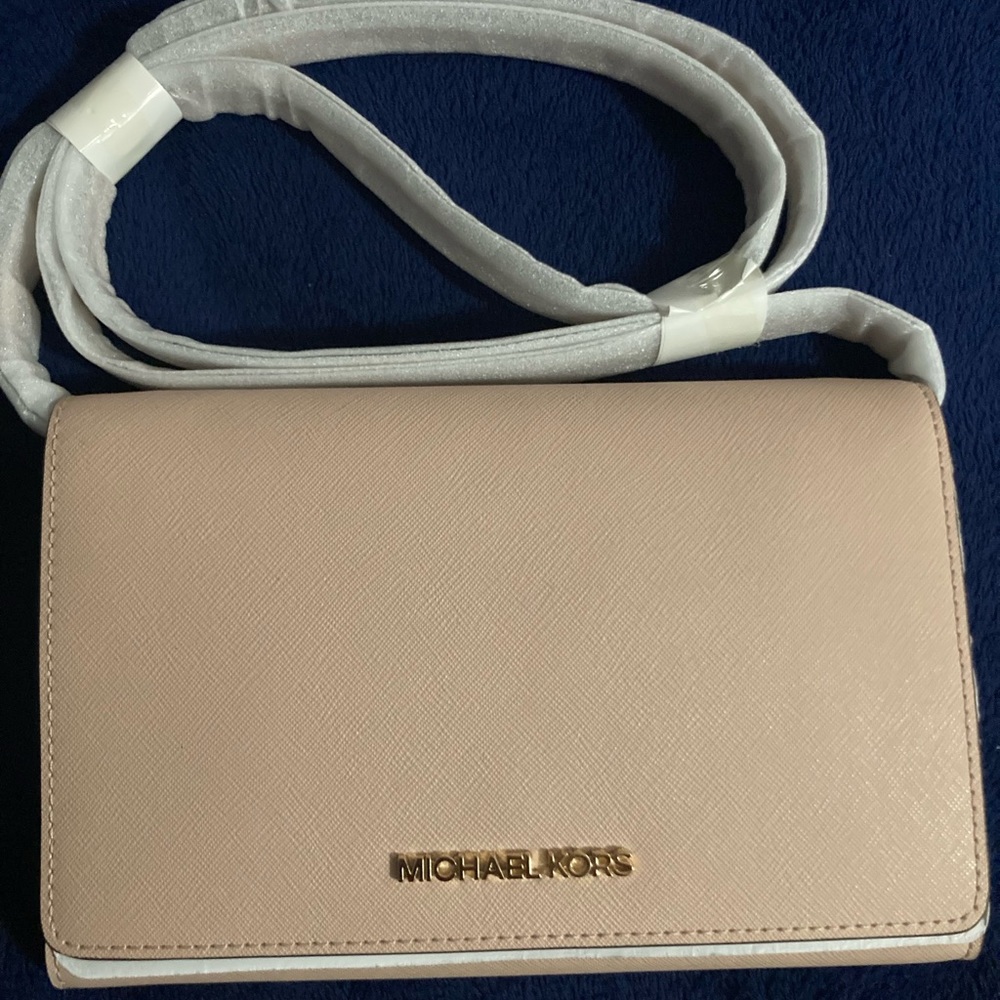 MK bag small brand new with packaging paper on it.